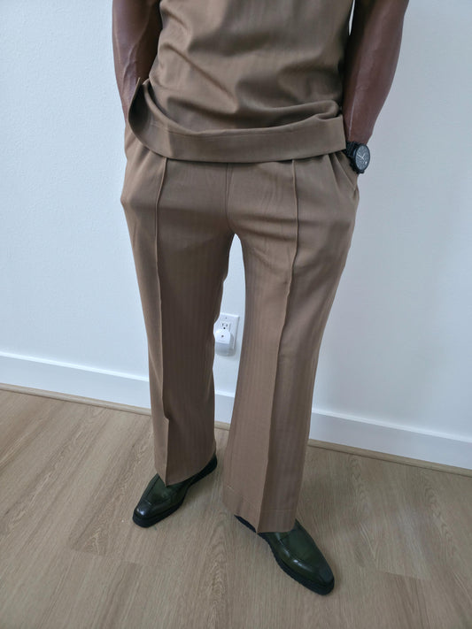 Dune caramel two-piece set featuring a short-sleeved V-neck tunic and matching straight-leg trousers with a sharp front crease. - Pants 