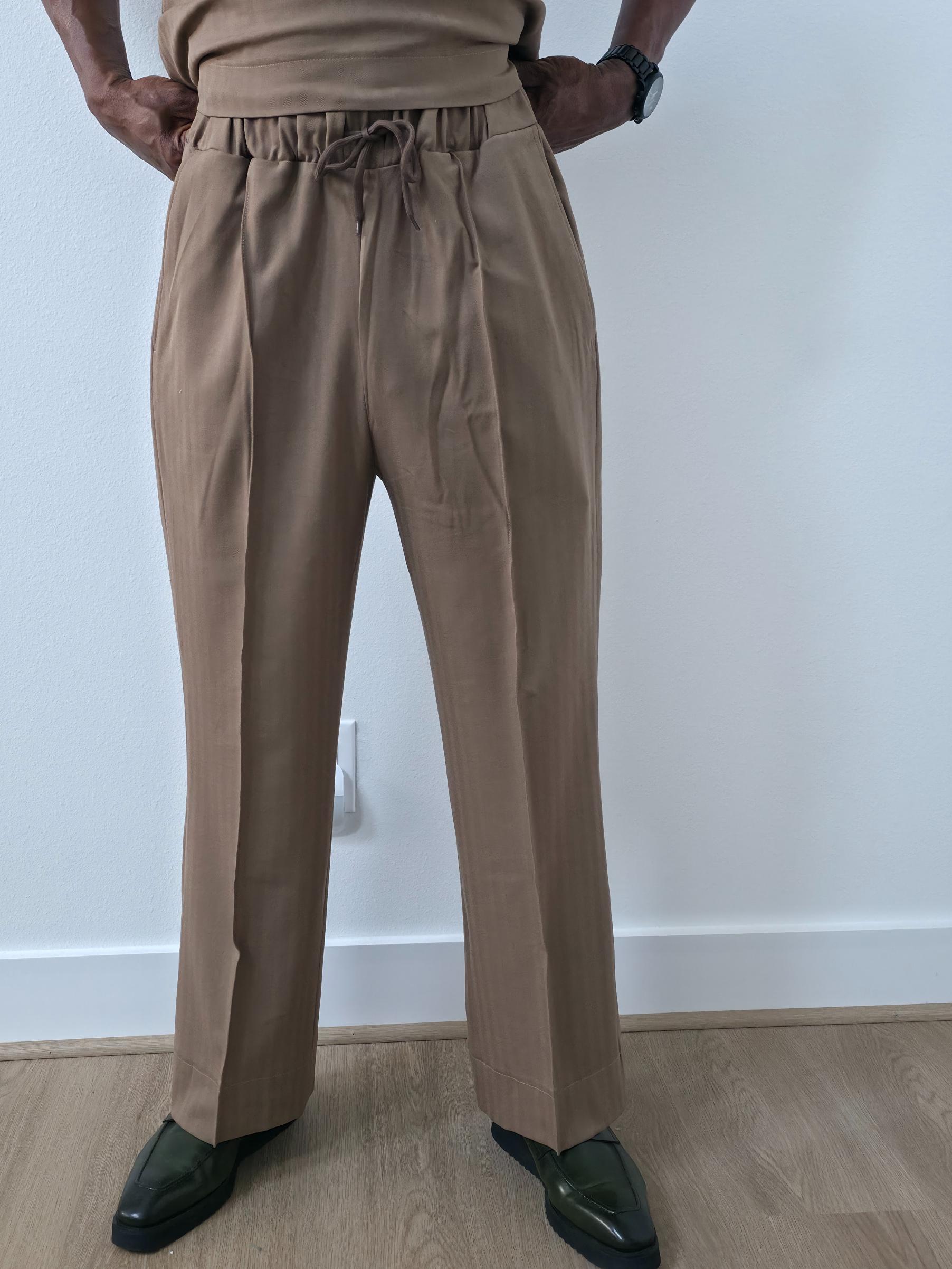 Dune caramel two-piece set featuring a short-sleeved V-neck tunic and matching straight-leg trousers with a sharp front crease. -Pant Full view