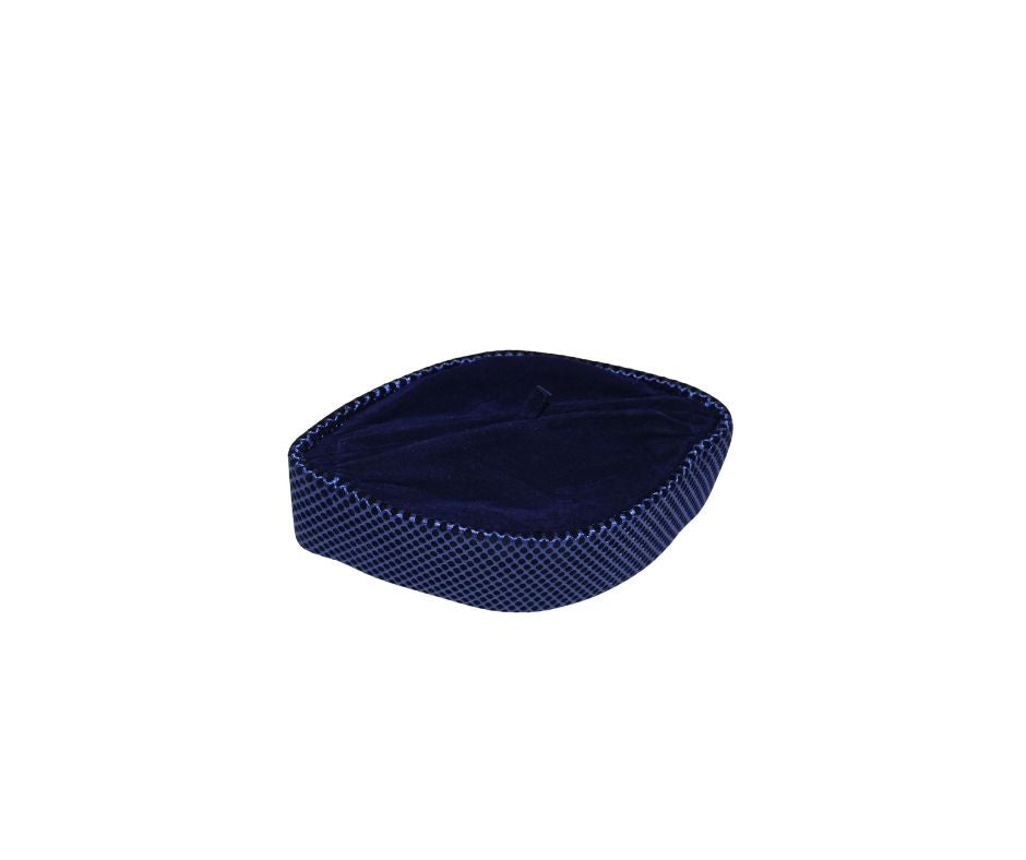 Kufi Hat featuring a dark velvet interior and a striking metallic cobalt blue crisscross weave pattern across the structured exterior.