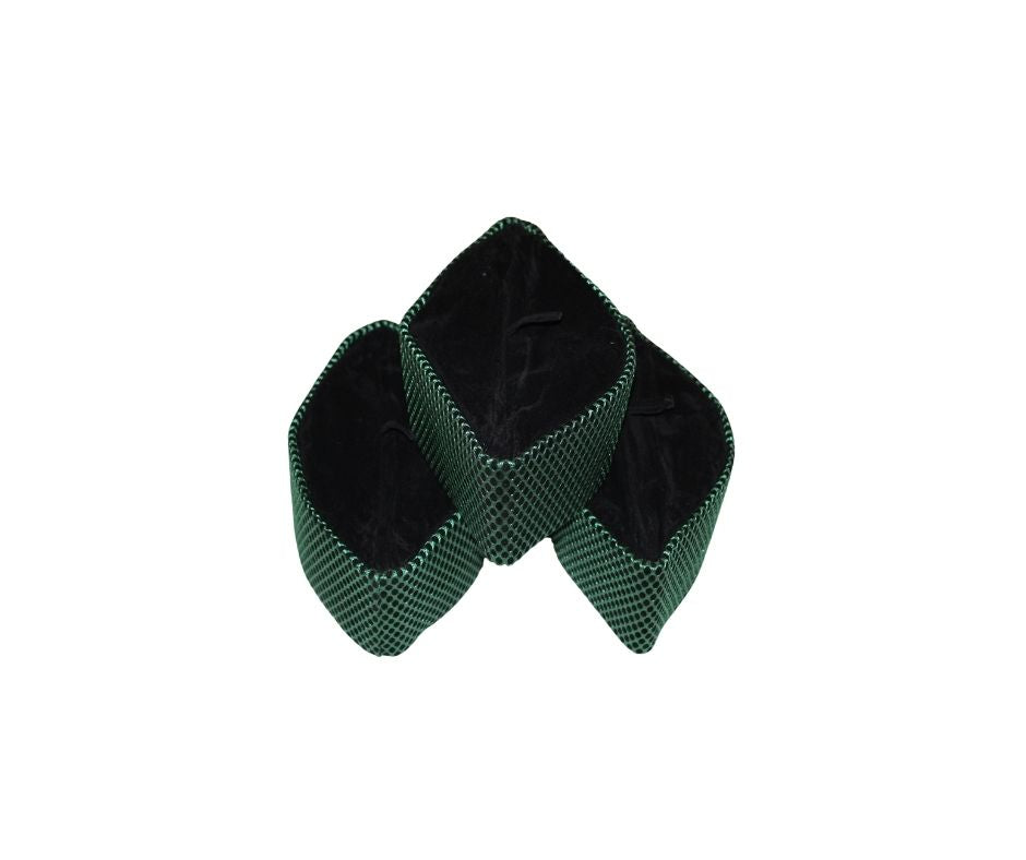 Kufi Hat featuring a dark velvet interior and a striking emerald green metallic crisscross weave across the entire exterior.