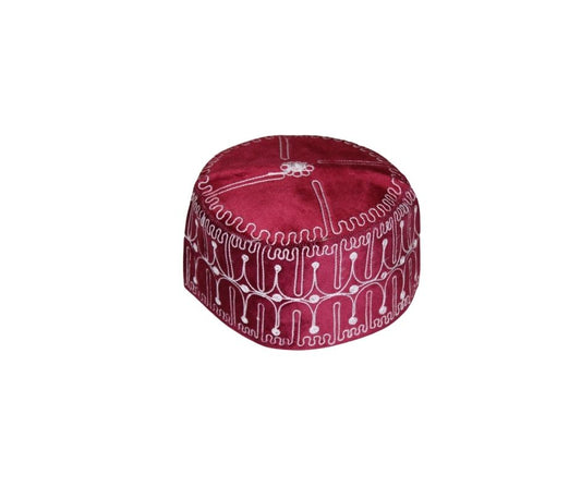 Ado Kufi Hat featuring a deep garnet red body with white circular and linear embroidered patterns
