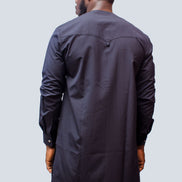 African Men's Suit featuring a longline navy blue tunic with a round neckline, a central vertical white placket detail accented by light blue and red threading, a matching decorated chest pocket welt, and tailored coordinating trousers