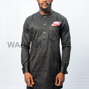African Men's Suit featuring a longline black patterned jacquard tunic with a band collar, buttoned placket, a single patch pocket on the chest, and coordinating tailored trousers