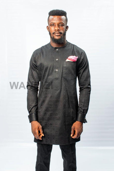African Men's Suit featuring a longline black patterned jacquard tunic with a band collar, buttoned placket, a single patch pocket on the chest, and coordinating tailored trousers