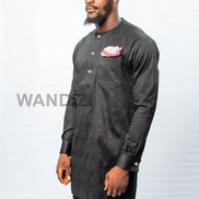 African Men's Suit featuring a longline black patterned jacquard tunic with a band collar, buttoned placket, a single patch pocket on the chest, and coordinating tailored trousers