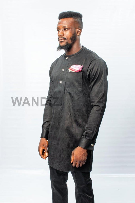 African Men's Suit featuring a longline black patterned jacquard tunic with a band collar, buttoned placket, a single patch pocket on the chest, and coordinating tailored trousers
