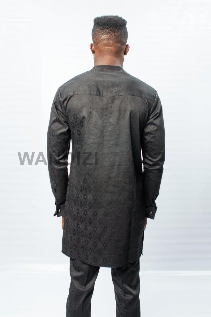 African Men's Suit featuring a longline black patterned jacquard tunic with a band collar, buttoned placket, a single patch pocket on the chest, and coordinating tailored trousers