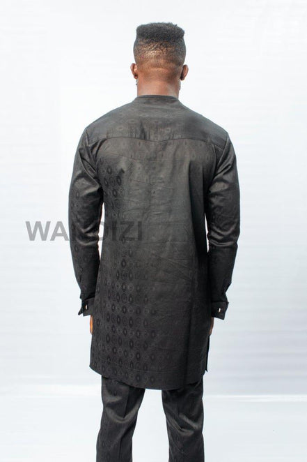 African Men's Suit featuring a longline black patterned jacquard tunic with a band collar, buttoned placket, a single patch pocket on the chest, and coordinating tailored trousers