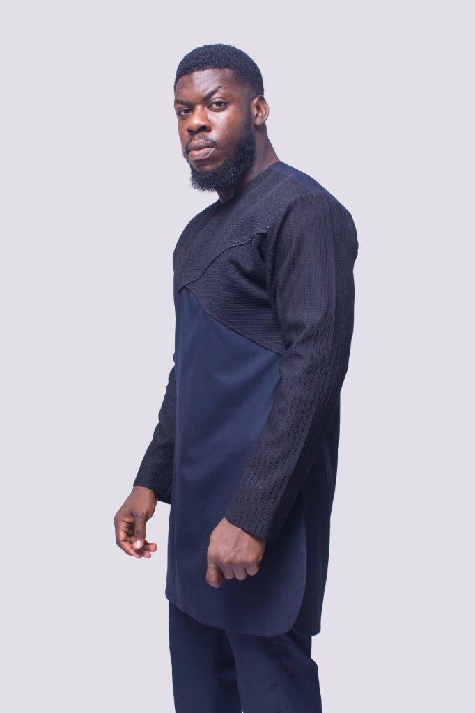 African Men's Suit featuring a longline dark tunic with a criss-cross textured black net fabric paneled across the upper chest and sleeves, paired with tailored coordinating trousers