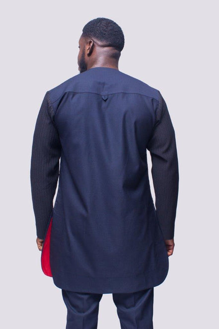 African Men's Suit featuring a longline dark tunic with a criss-cross textured black net fabric paneled across the upper chest and sleeves, paired with tailored coordinating trousers