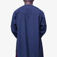 African Men's Suit featuring a longline deep blue tunic with a round neckline, a distinctive central vertical black velvet panel, a velvet-accented chest pocket, and tailored matching trousers