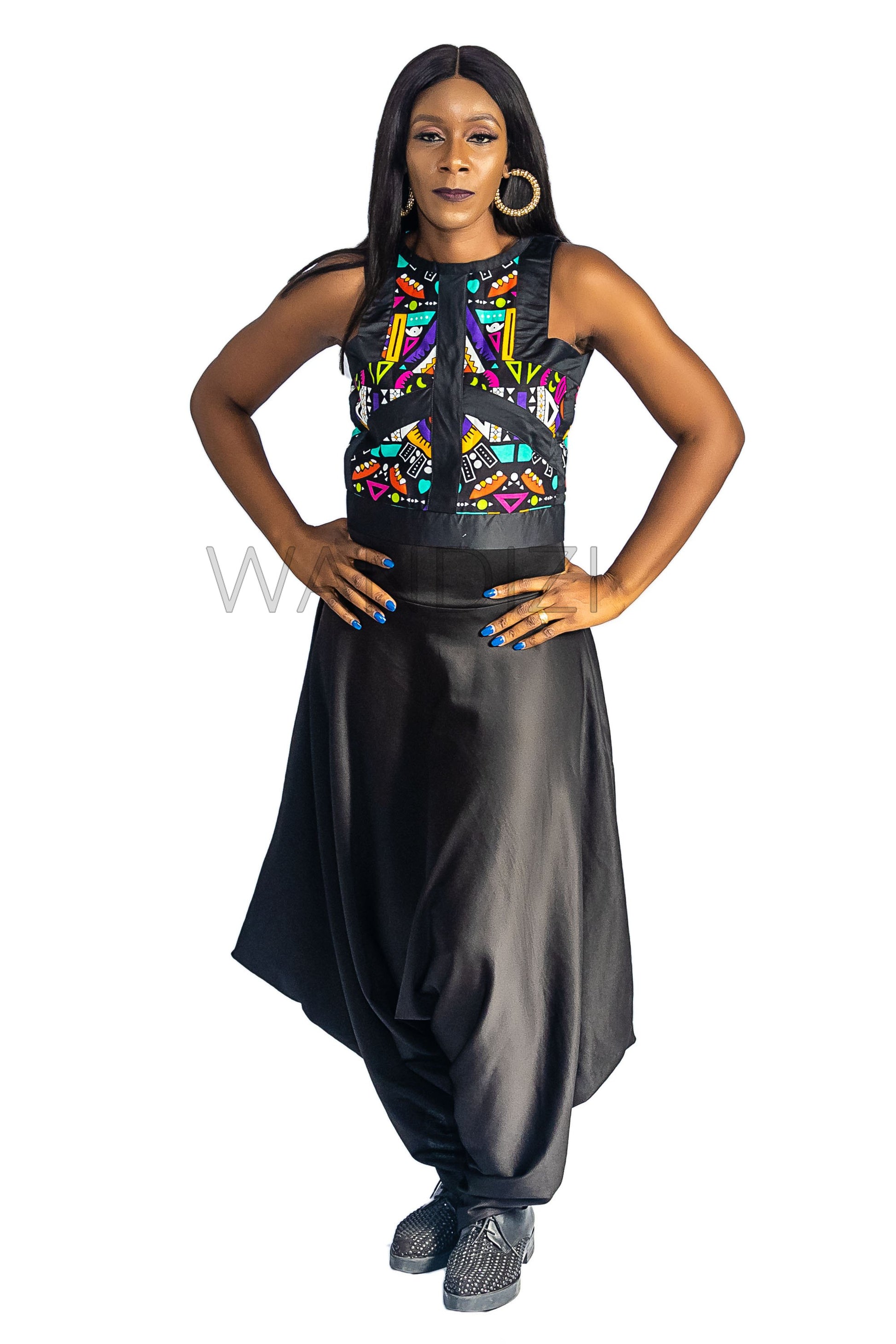 Ankara Top featuring a sleeveless, high-neck crop silhouette with a vibrant purple, yellow, and turquoise geometric neon pattern enclosed within bold black structural borders