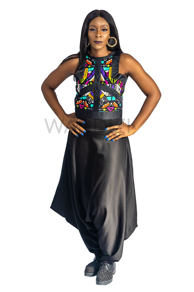 Ankara Top featuring a sleeveless, high-neck crop silhouette with a vibrant purple, yellow, and turquoise geometric neon pattern enclosed within bold black structural borders