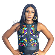 Ankara Top featuring a sleeveless, high-neck crop silhouette with a vibrant purple, yellow, and turquoise geometric neon pattern enclosed within bold black structural borders