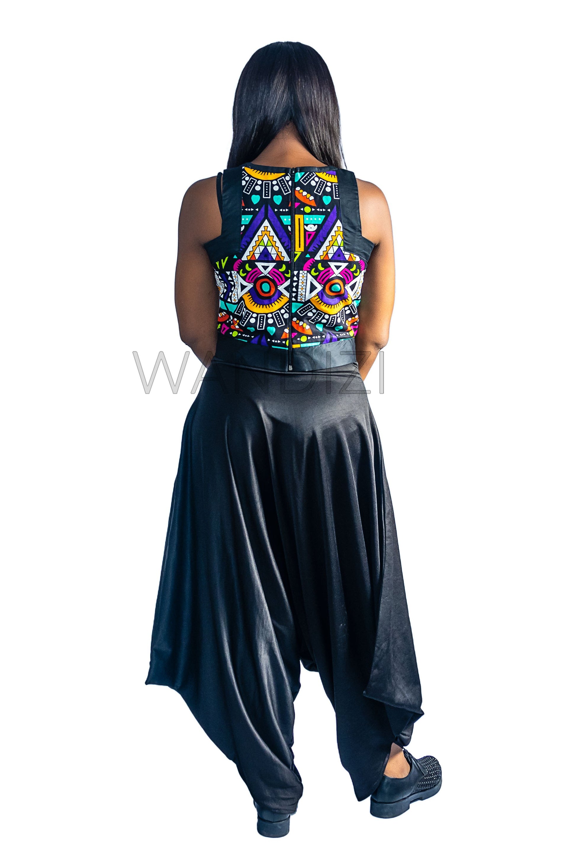 Ankara Top featuring a sleeveless, high-neck crop silhouette with a vibrant purple, yellow, and turquoise geometric neon pattern enclosed within bold black structural borders