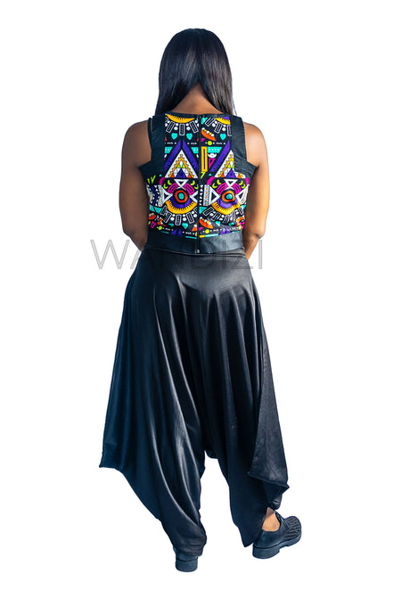 Ankara Top featuring a sleeveless, high-neck crop silhouette with a vibrant purple, yellow, and turquoise geometric neon pattern enclosed within bold black structural borders