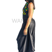 Ankara Top featuring a sleeveless, high-neck crop silhouette with a vibrant green, orange, and yellow geometric print paneled with broad black structural borders