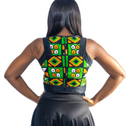 Ankara Top featuring a sleeveless, high-neck crop silhouette with a vibrant green, orange, and yellow geometric print paneled with broad black structural borders