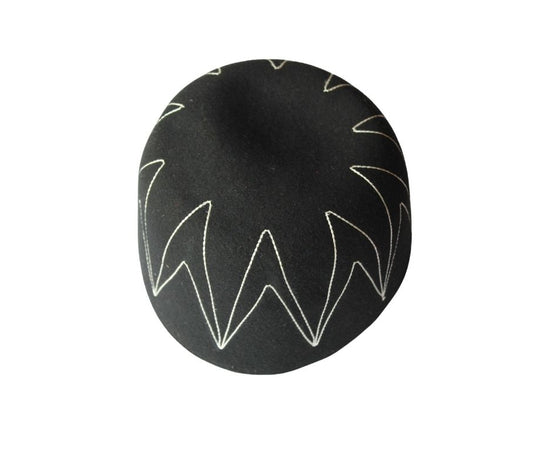 Awo Cap featuring a black wool body with white zigzag zenith stitching