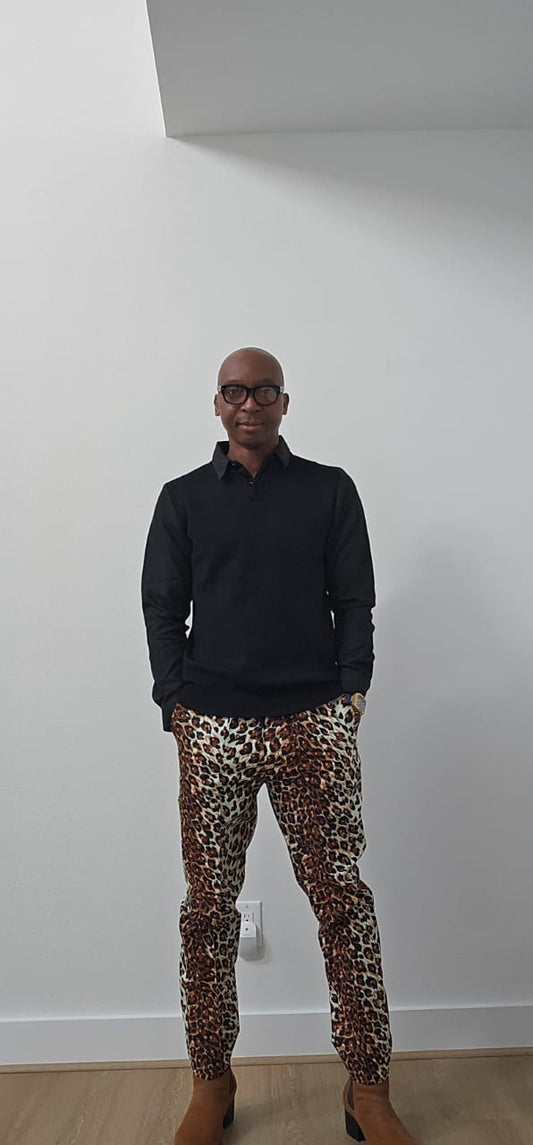 Chiseled Trousers featuring a bold leopard print pattern with a tapered, tailored fit