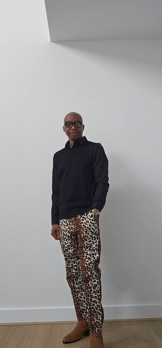 Chiseled Trousers featuring a bold leopard print pattern with a tapered, tailored fit