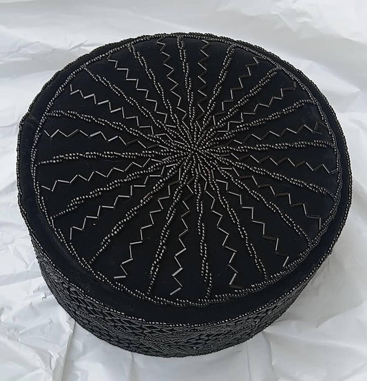Crown Cap featuring rich black velvet adorned with intricate, hand-stitched black beadwork in starburst and geometric lattice patterns.