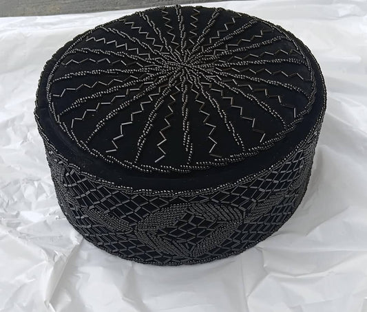 Crown Cap featuring rich black velvet adorned with intricate, hand-stitched black beadwork in starburst and geometric lattice patterns.