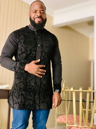 Customer Photo man wearing a black traditional africa shirt