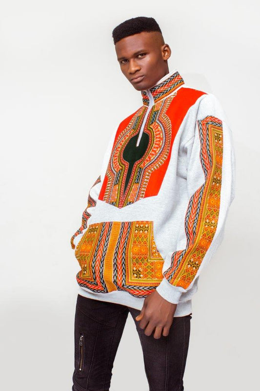 Dashiki Bomber Jacket featuring a light grey body with a striking orange, yellow, and green traditional African print on the high collar, chest panel, front pouch pocket, and sleeve borders