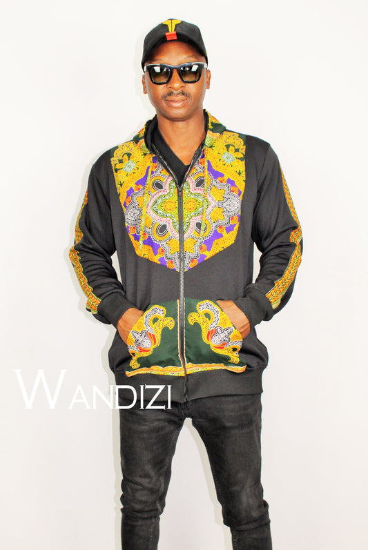 Dashiki Hoodie Jacket featuring a black body with a vibrant yellow, purple, and green traditional ornate pattern on the front bodice, kangaroo pocket, and outer sleeve lines