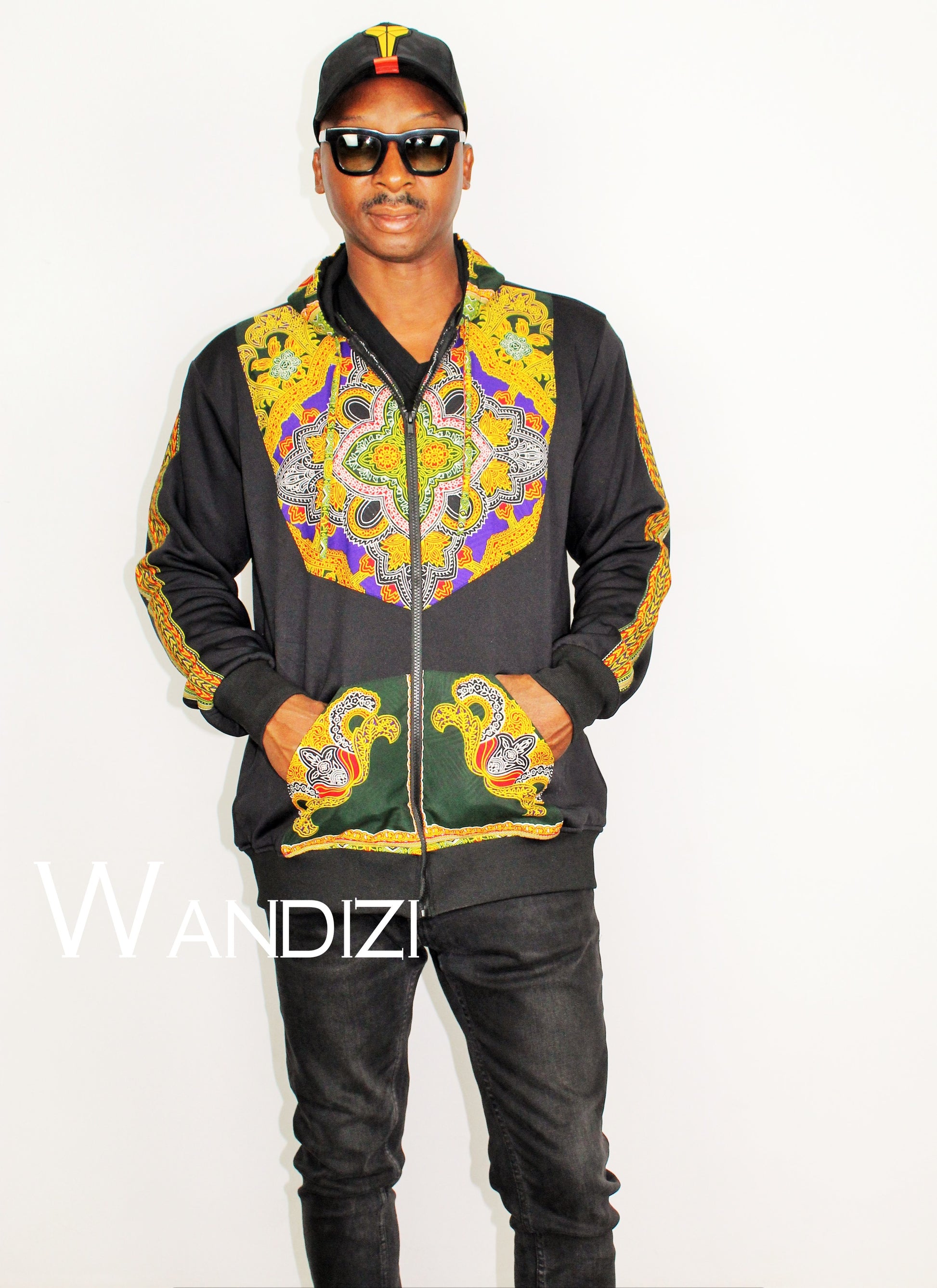 Dashiki Hoodie Jacket featuring a black body with a vibrant yellow, purple, and green traditional ornate pattern on the front bodice, kangaroo pocket, and outer sleeve lines