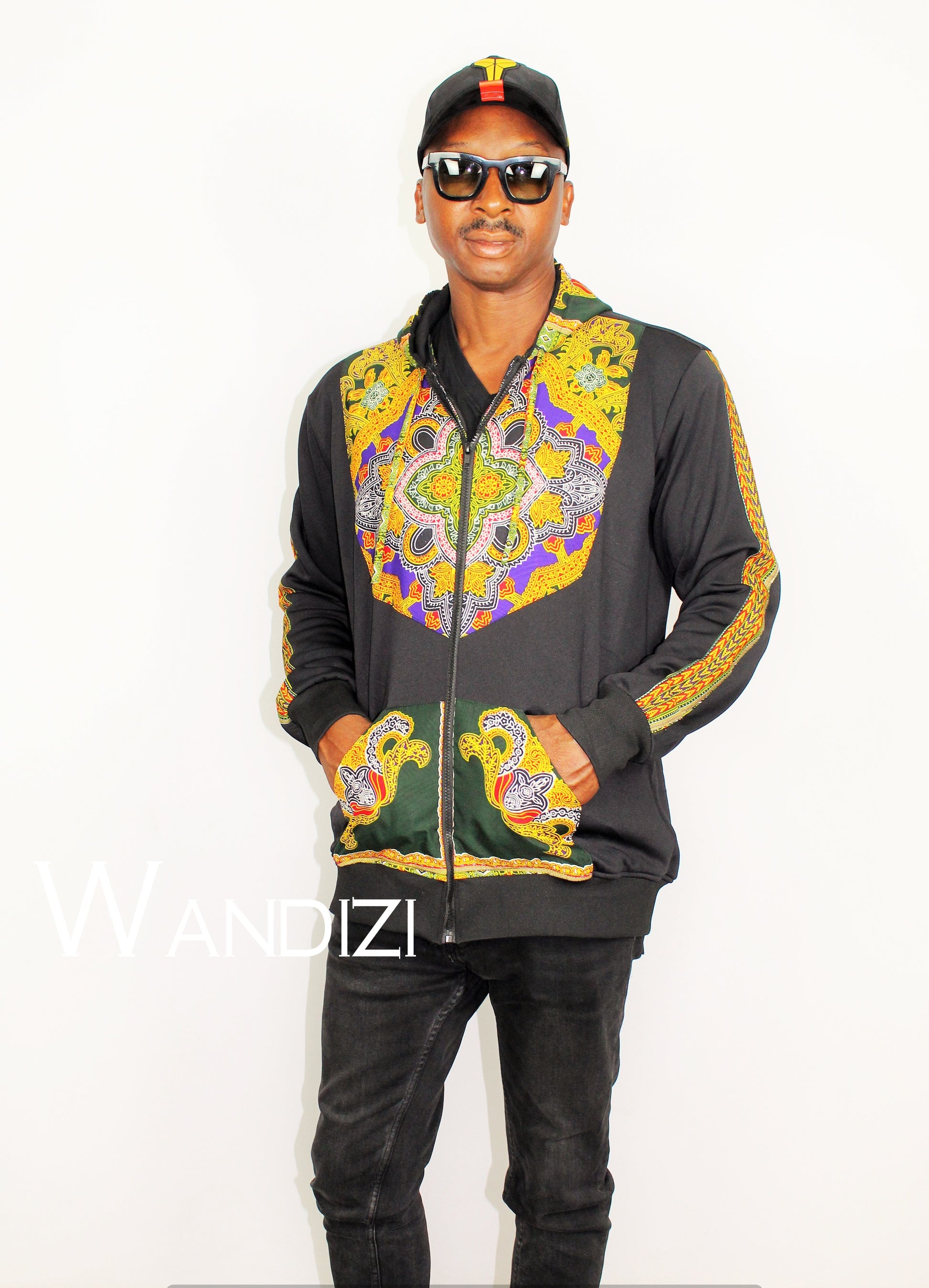 Dashiki Hoodie Jacket featuring a black body with a vibrant yellow, purple, and green traditional ornate pattern on the front bodice, kangaroo pocket, and outer sleeve lines
