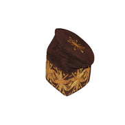 Fila Cap featuring deep brown velvet with a central gold starburst and a continuous gold floral-geometric pattern around the base.