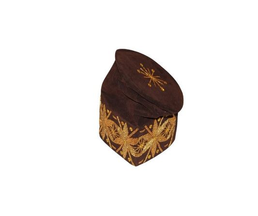 Fila Cap featuring deep brown velvet with a central gold starburst and a continuous gold floral-geometric pattern around the base.