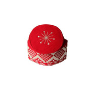Fila Cap featuring a rich red velvet crown with a central starburst embroidery and a geometric lattice pattern around the base.