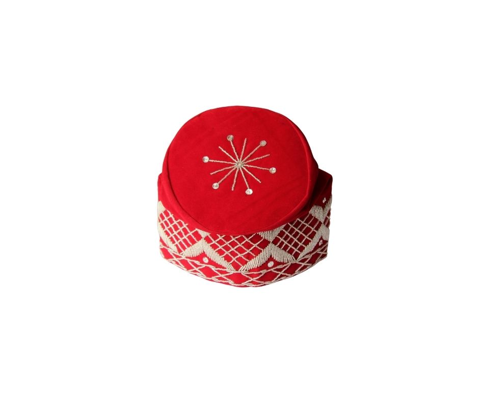Fila Cap featuring a rich red velvet crown with a central starburst embroidery and a geometric lattice pattern around the base.