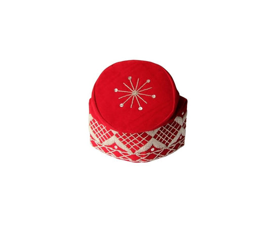Fila Cap featuring a rich red velvet crown with a central starburst embroidery and a geometric lattice pattern around the base.