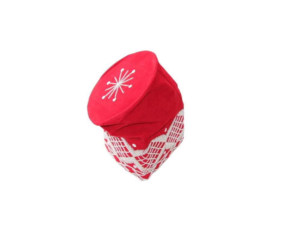 Fila Cap featuring a rich red velvet crown with a central starburst embroidery and a geometric lattice pattern around the base.