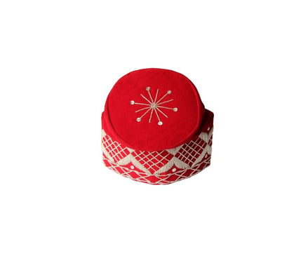 Fila Cap featuring a rich red velvet crown with a central starburst embroidery and a geometric lattice pattern around the base.