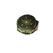Fila Cap featuring olive green velvet with a central gold starburst and flowing gold leaf embroidery around the base.