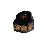 Fila Cap featuring solid black velvet with a central gold starburst and a series of circular gold floral motifs embroidered around the base.