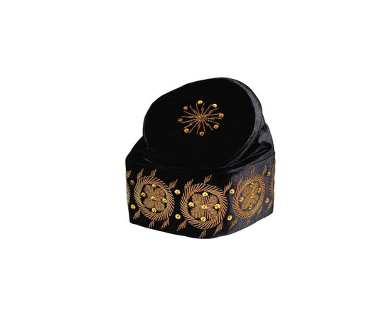 Fila Cap featuring solid black velvet with a central gold starburst and a series of circular gold floral motifs embroidered around the base.