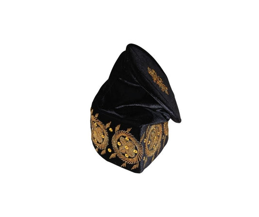 Fila Cap featuring solid black velvet with a central gold starburst and a series of circular gold floral motifs embroidered around the base.