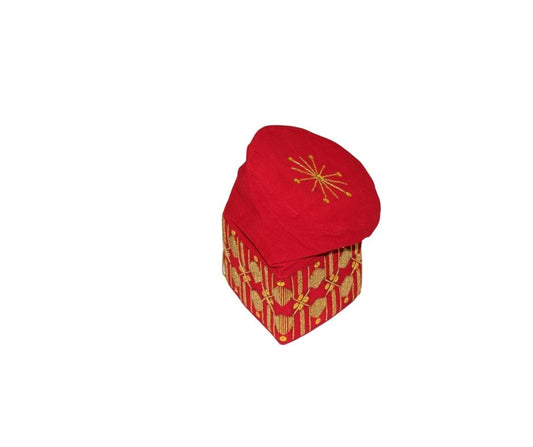 Fila Cap featuring a rich red velvet crown with a central gold starburst and a geometric gold pattern around the base.