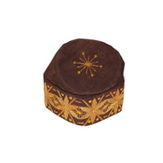 Fila Cap featuring deep brown velvet with a central gold starburst and a continuous gold floral-geometric pattern around the base.