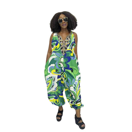 Harem Jumpsuit featuring a green botanical print, beaded V-neckline, and a voluminous drop-crotch silhouette.