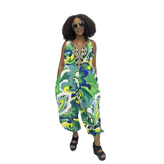 Harem Jumpsuit featuring a green botanical print, beaded V-neckline, and a voluminous drop-crotch silhouette.