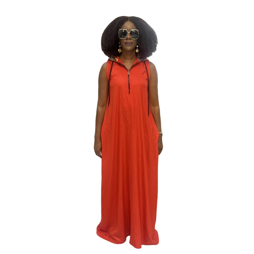 Sleeveless orange maxi dress featuring a hooded neckline with multicolor pattern lining, front zip detail, and a voluminous floor-length skirt.