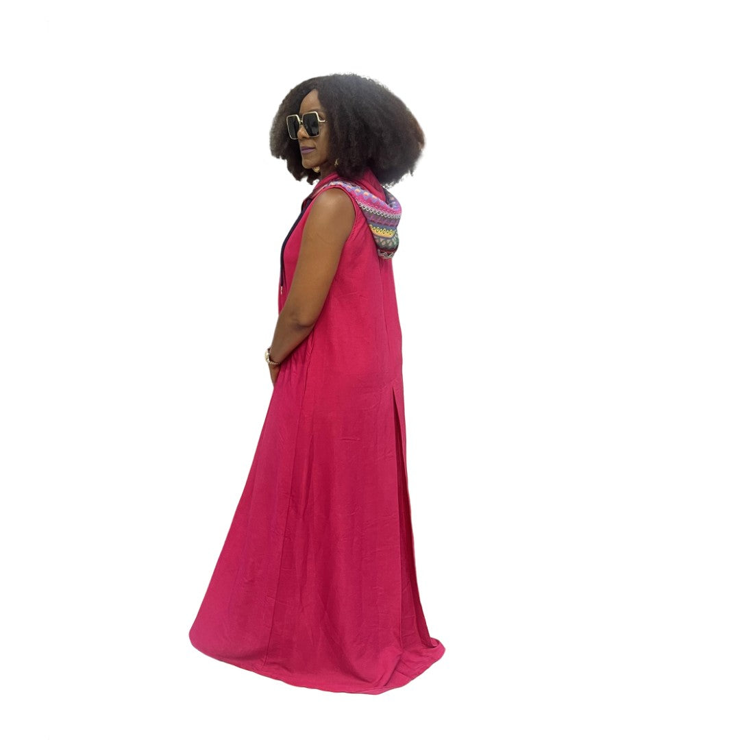Sleeveless fuchsia maxi dress featuring a front zipper, side pockets, and a hoodie with a multicolor patterned lining.