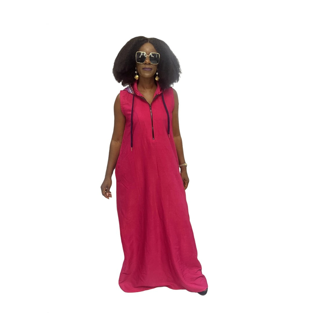 Sleeveless fuchsia maxi dress featuring a front zipper, side pockets, and a hoodie with a multicolor patterned lining.